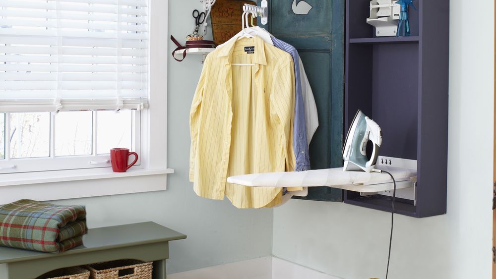 a finished shutter door ironing cabinet