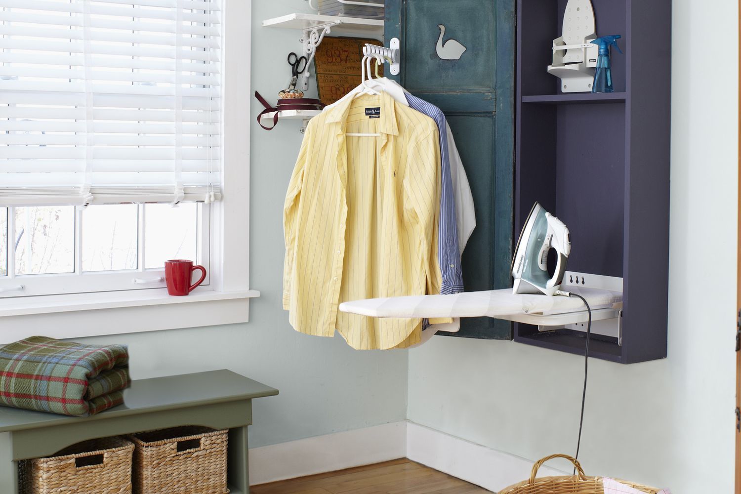 a finished shutter door ironing cabinet