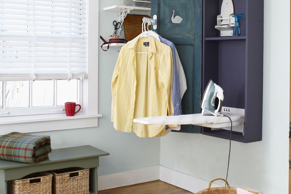 a finished shutter door ironing cabinet
