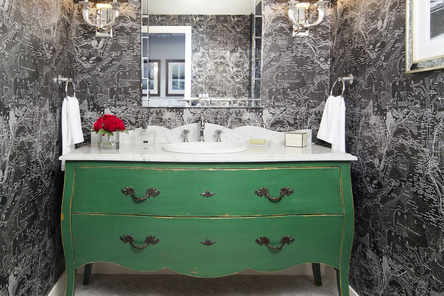 A vanity made out of a modified wooden dresser.
