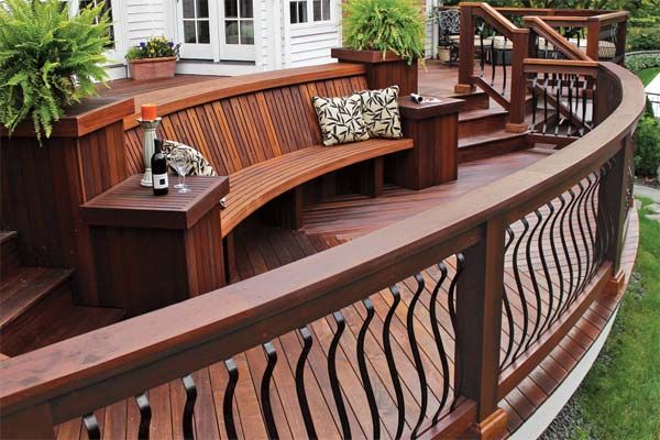 A hardwood deck with metal balusters and railing.