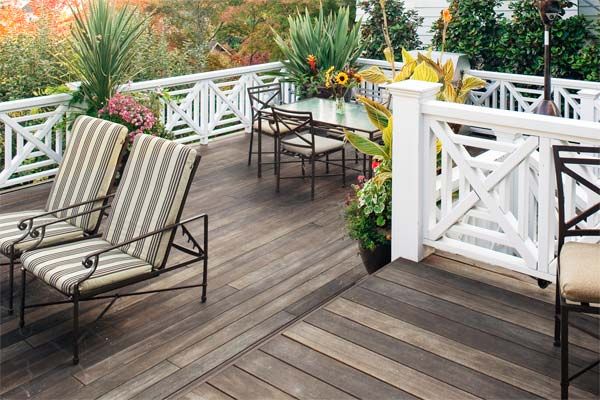 A hardwood deck with metal railing.