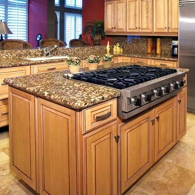 A kitchen island with a stovetop.