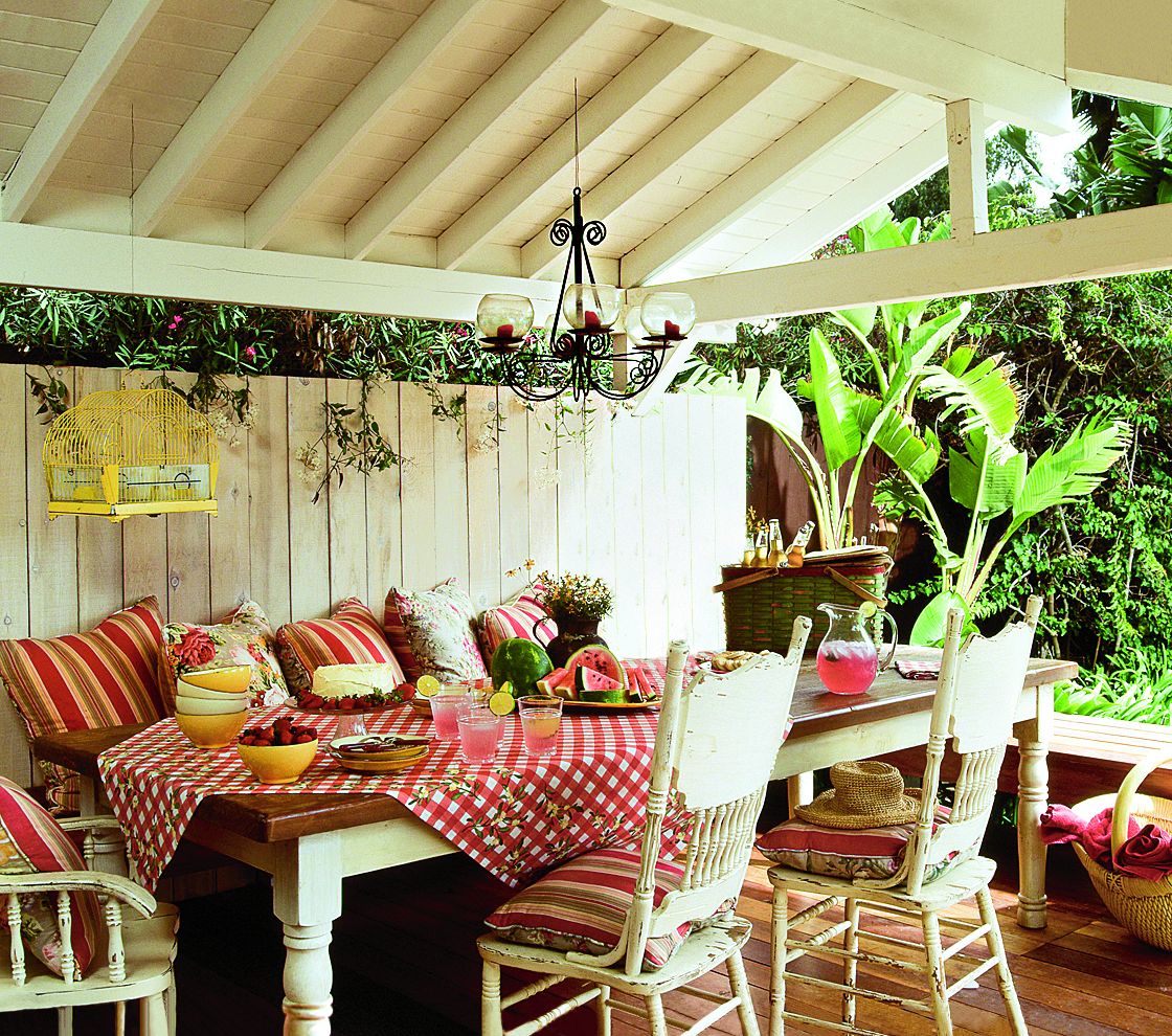 A covered carport for an outdoor dining space.