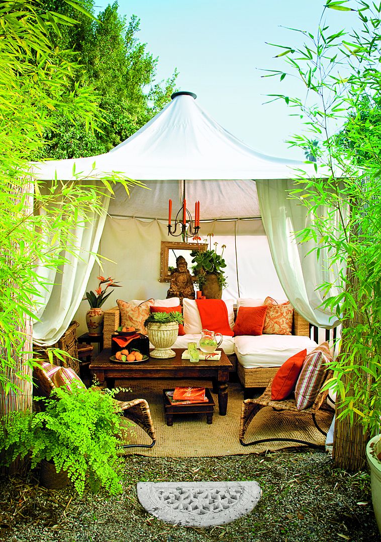 A canvas cabana for an outdoor dining space.