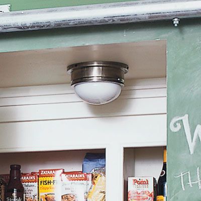 an overhead light within a pantry