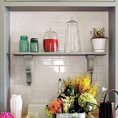 a backsplash behind a hutch and kitchen sink