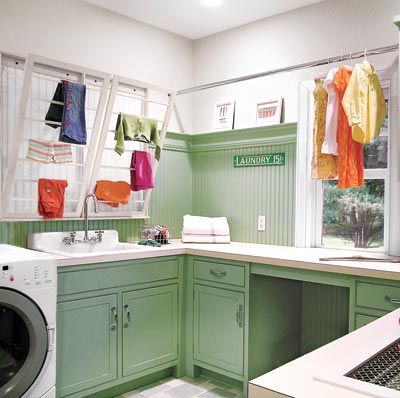 a laundry room with green and white colors