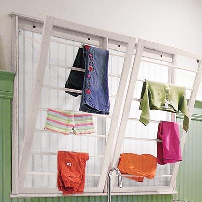 a drying rack that pulls out from a wall