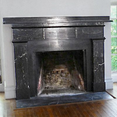 A non-working fireplace that can be transformed into decorative storage.