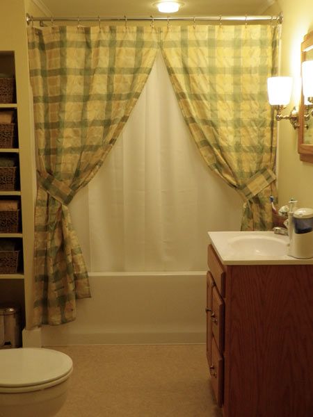 Tub-sweeping curtains to frame the area.