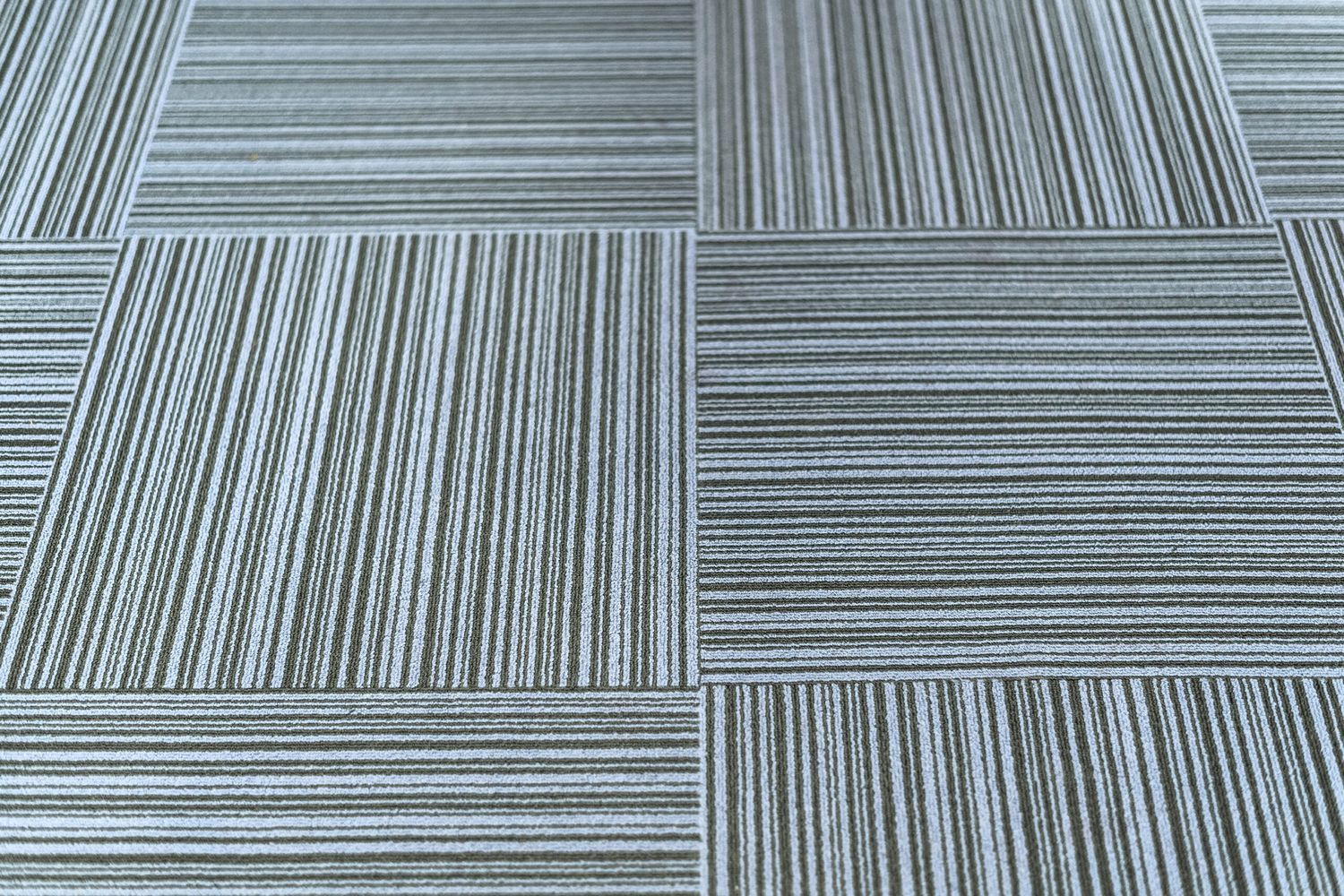 A set of carpet tiles covering a floor.