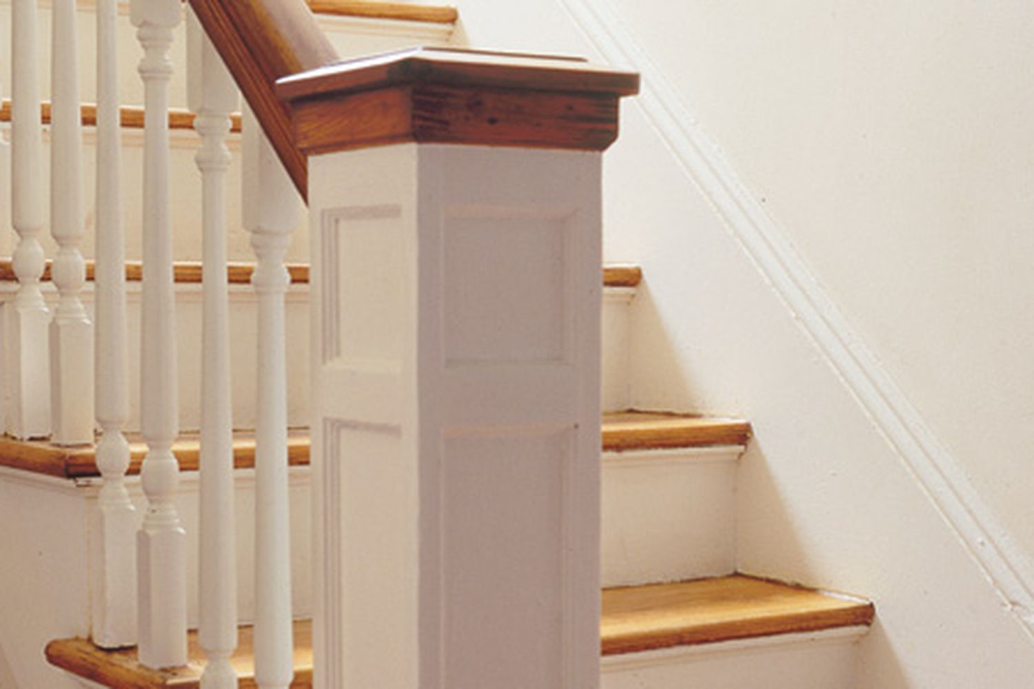 A series of balusters climbing up a stairwell.