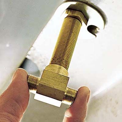 Image of tightening a nut for faucet replacement