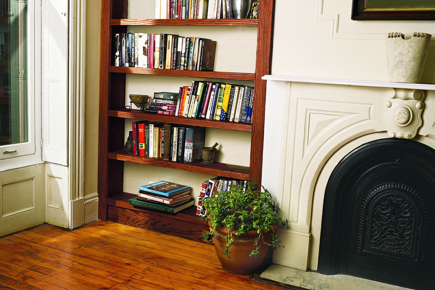 Finished homemade bookshelf made out of plywood.