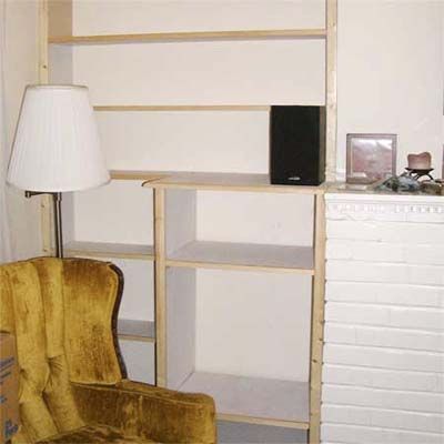 A built-in bookcase for storage in a small space.