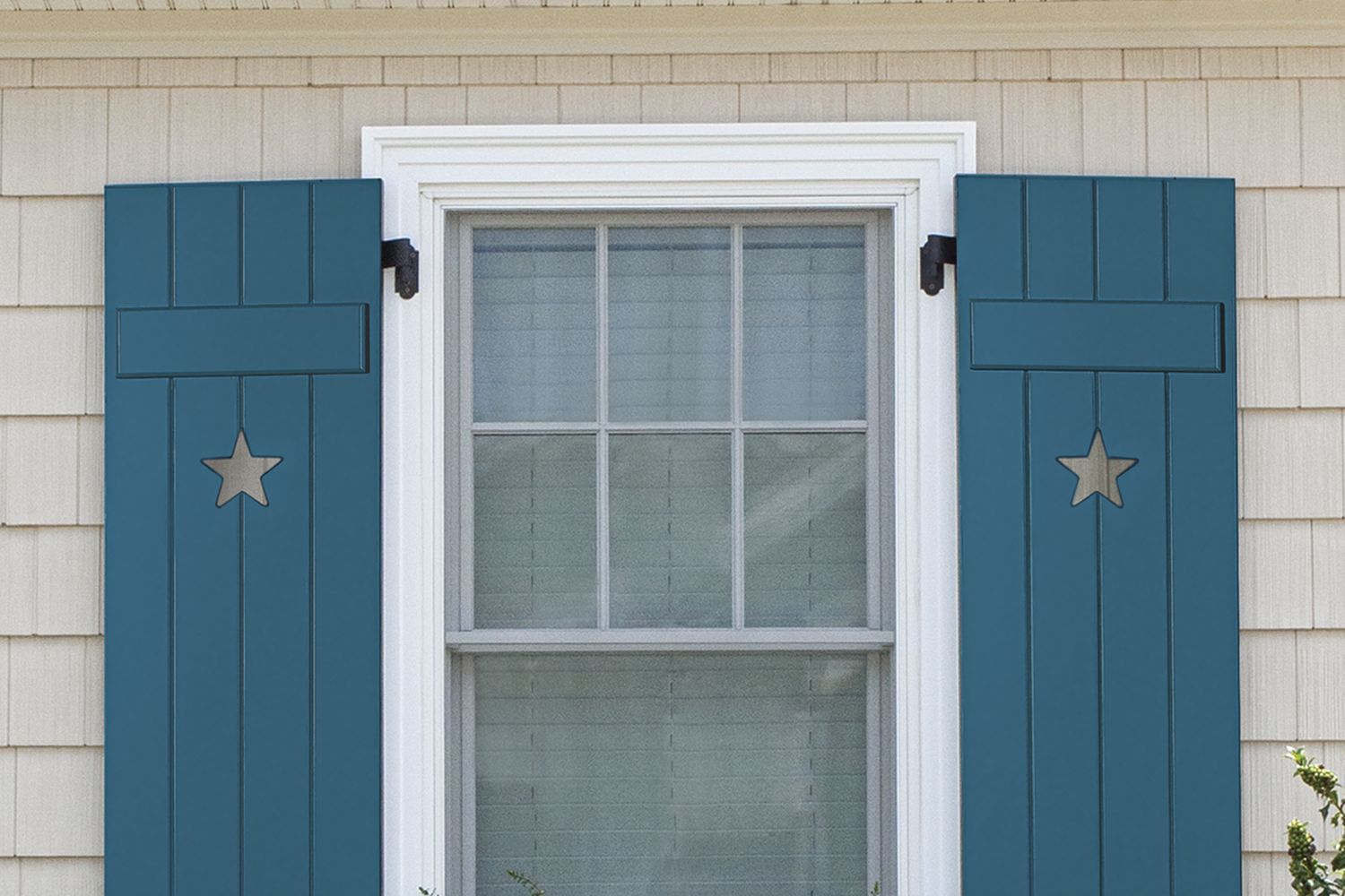 A blue board-and-batten shutter
