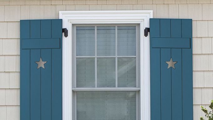 A blue board-and-batten shutter