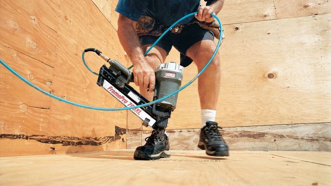 A man using a frame pro device to construct a flat roof.