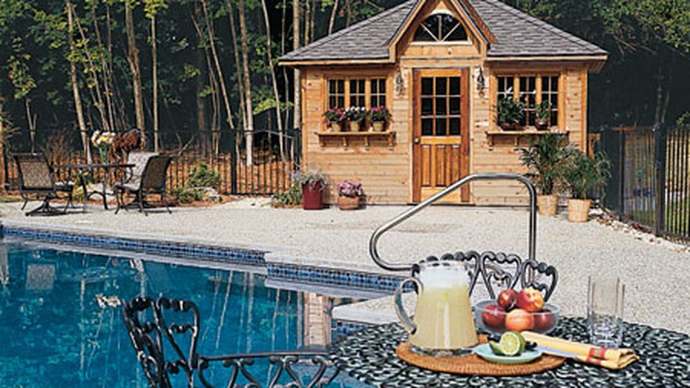 A cabana by an outdoor pool.