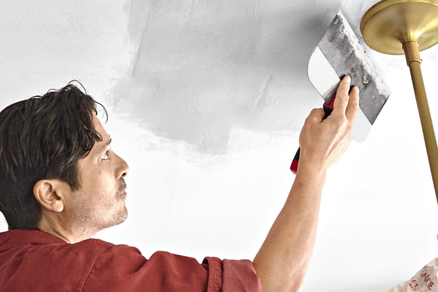 repairing a ceiling by patching it