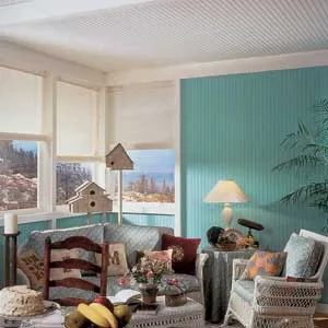A sitting room with a paneled ceiling.