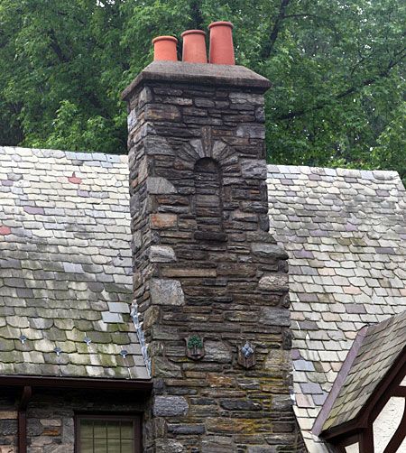 A stone chimney with quoins in the corner.