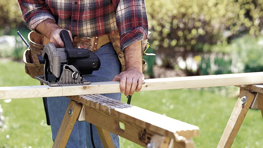 A man using a circular saw.