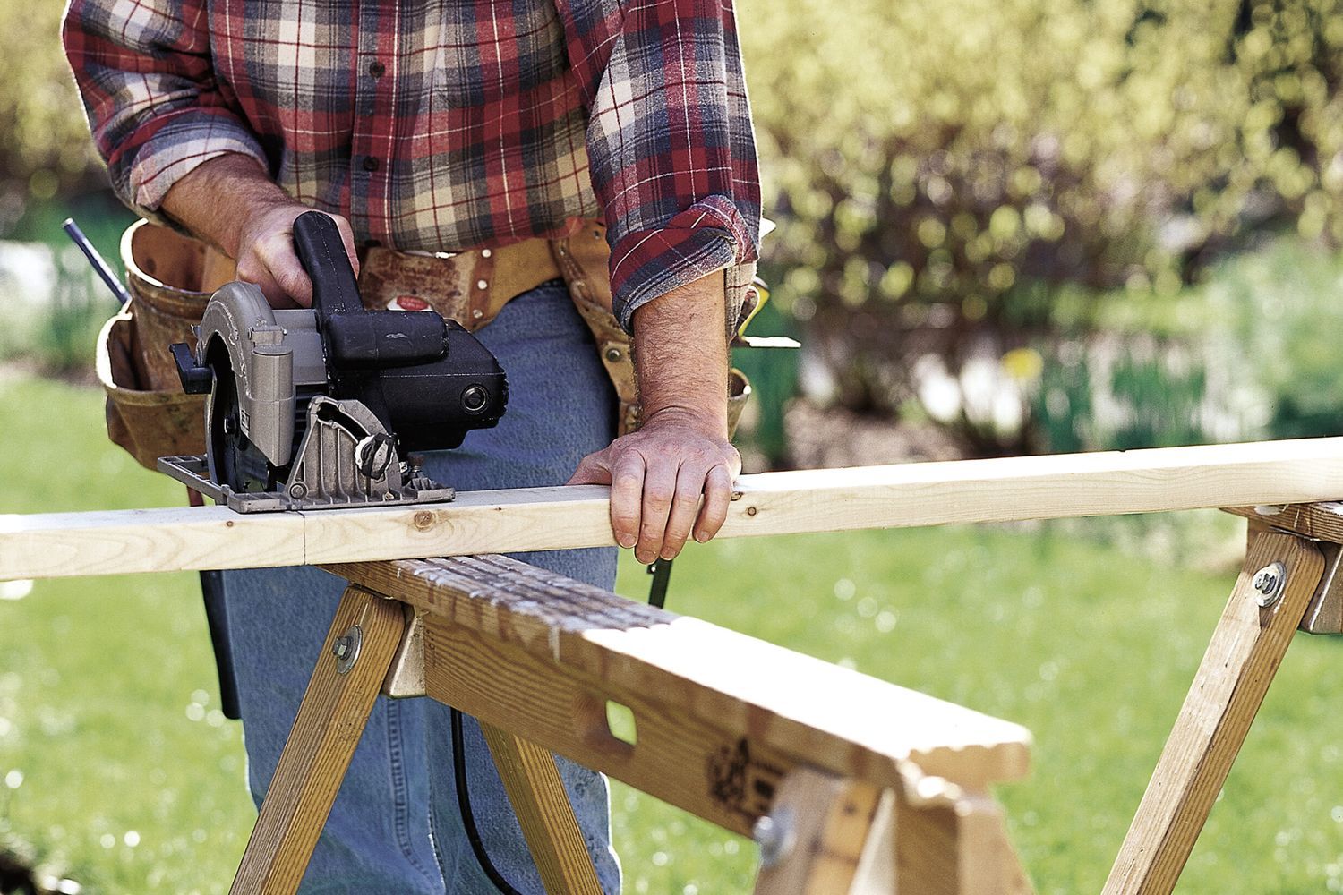 A man using a circular saw.
