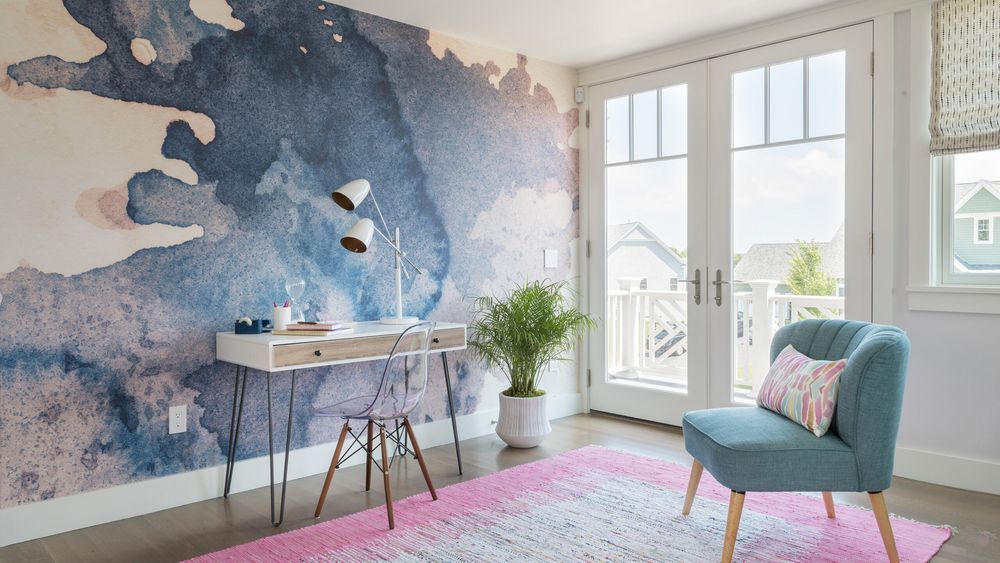 a colorful rug in a home office