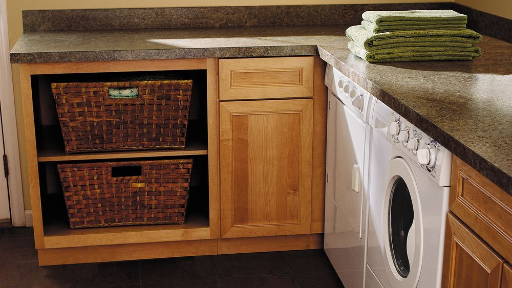 A laundry room with laminate countertops.