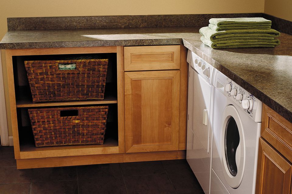 A laundry room with laminate countertops.