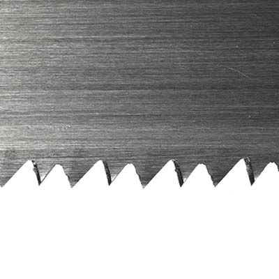 Close up look at the teeth of a crosscut handsaw.