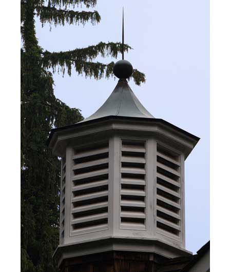 A pointed cupola at the top of a building.