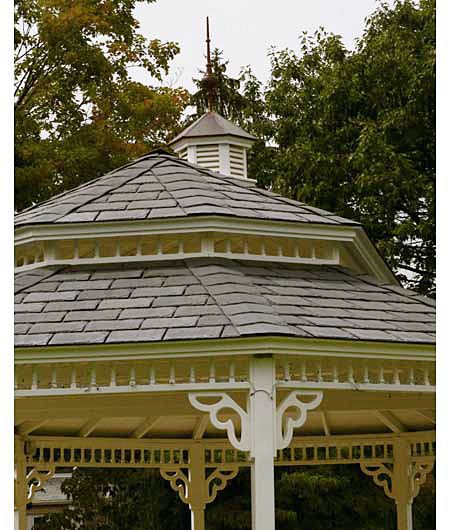 A gazebo with a cupola on top of it.