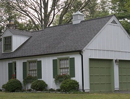 A building with a white cupola on top of it.