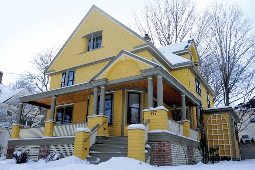 insulated windows on a yellow home during the winter