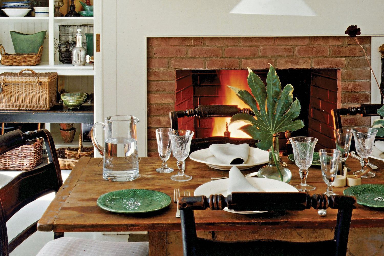 A dining room with a refinished table in the center.