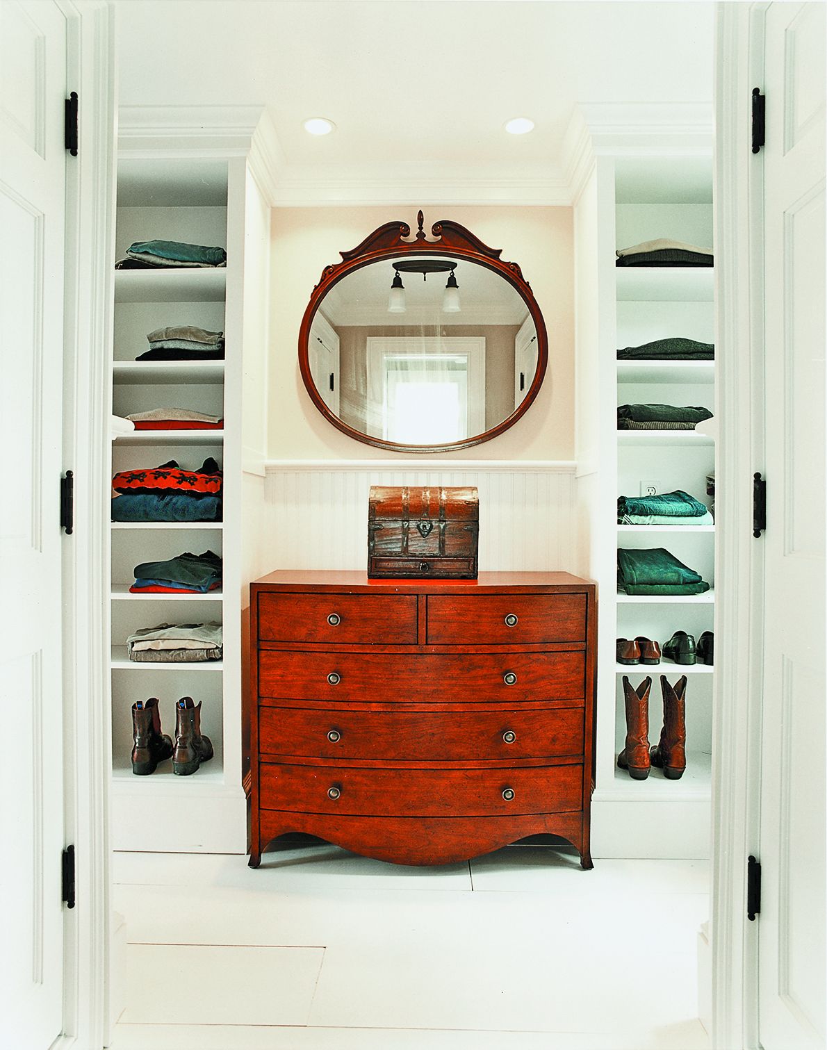 A dressing room with shelves for storage.