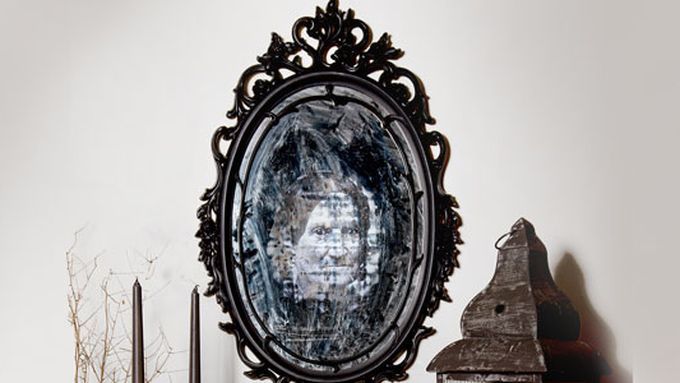 Image of a DIY eerie haunted mirror that adds a ghostly presence to any Halloween decor