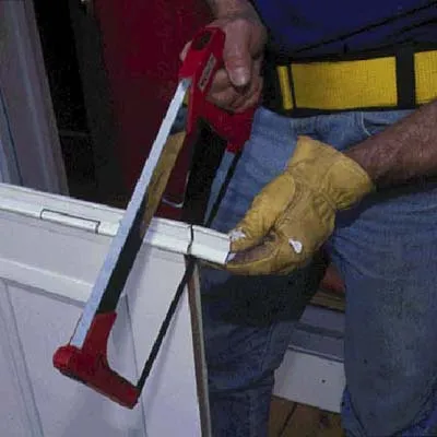 sawing unnecessary pieces from a storm door
