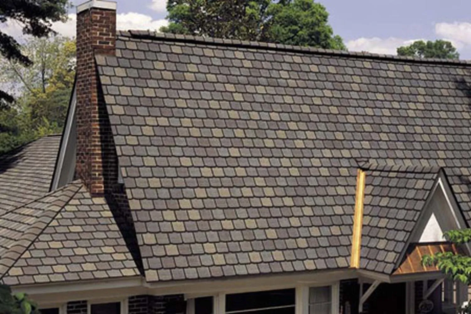 A house with shingles on it's roof.
