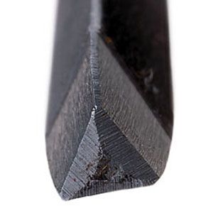 A zoomed in picture of a triangular file.