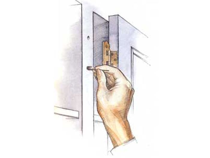 An illustration of a person repairing a hinge hole.