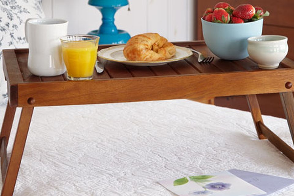 Folding serving tray being used for breakfast in bed.