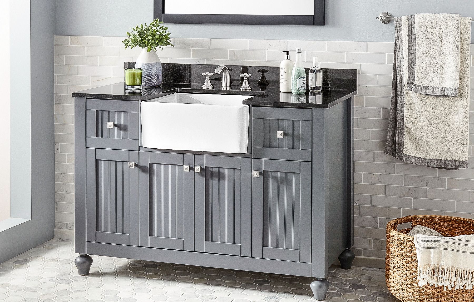 a farmhouse sink that is a part of bathroom vanity