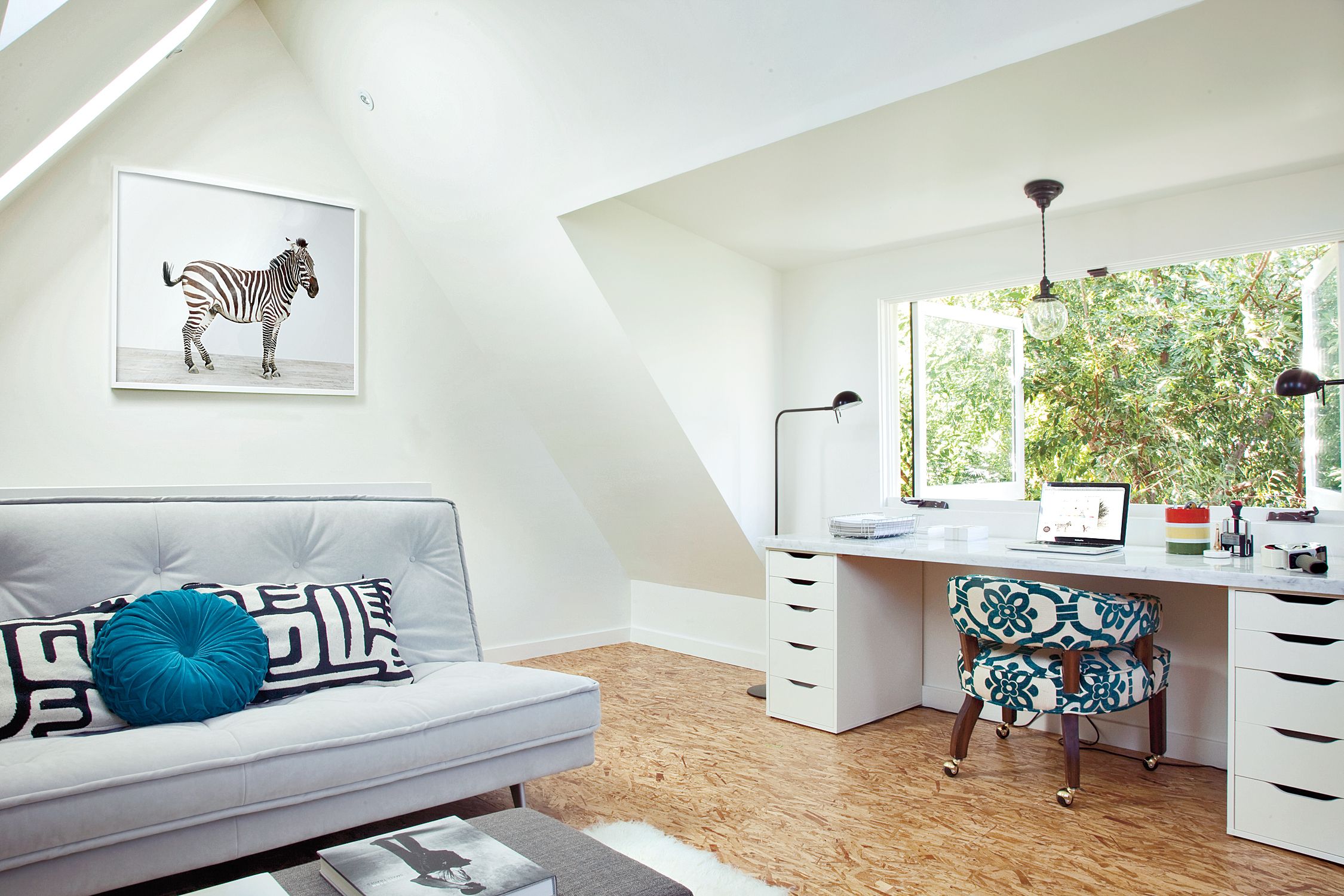 A finished attic with OSB flooring.