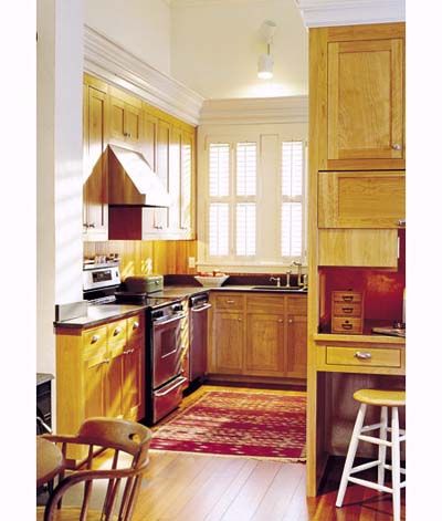 An image of a kitchen with concealed clutter and a well planned layout.