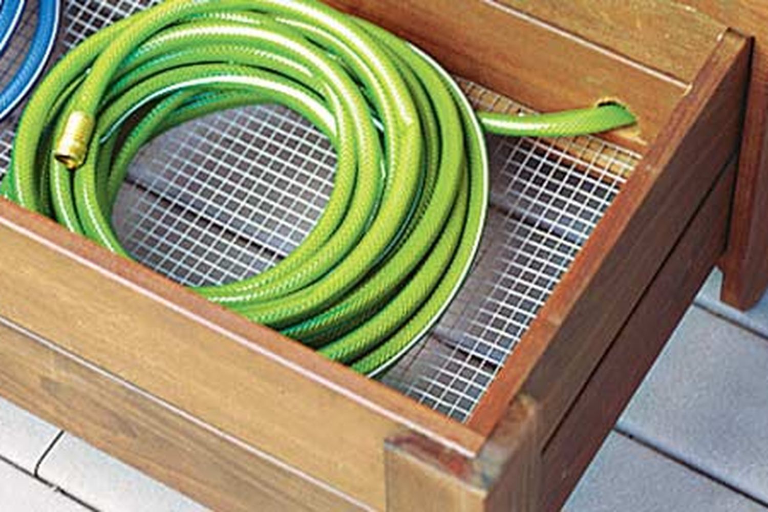 A storage bin with a base made of hardware cloth.
