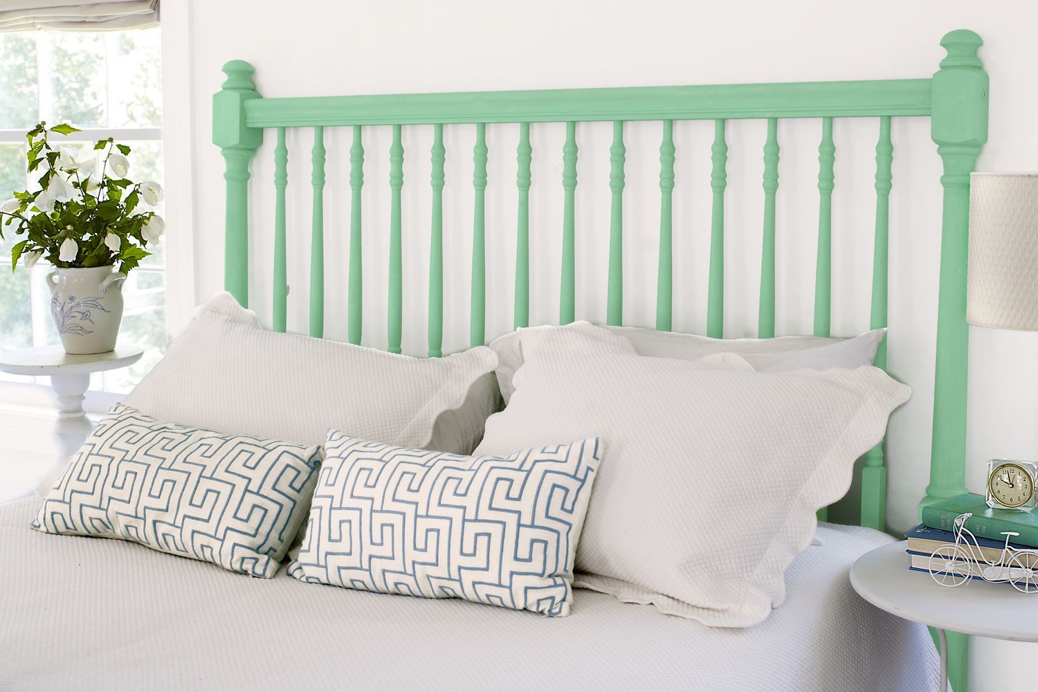 A bed with a DIY spindle headboard.